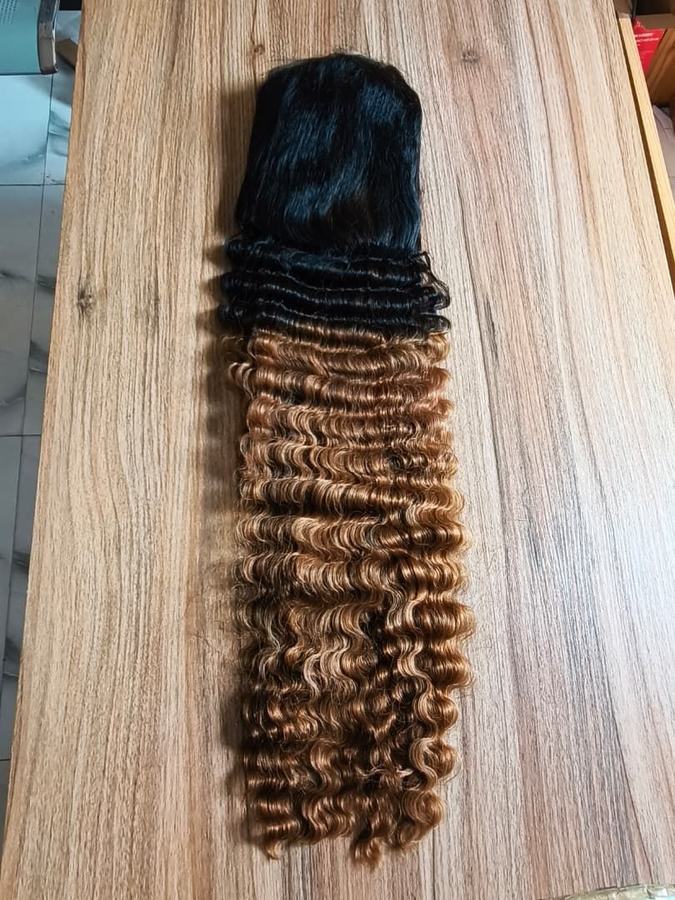 Long deep curl wig, black at the root blending into honey brown